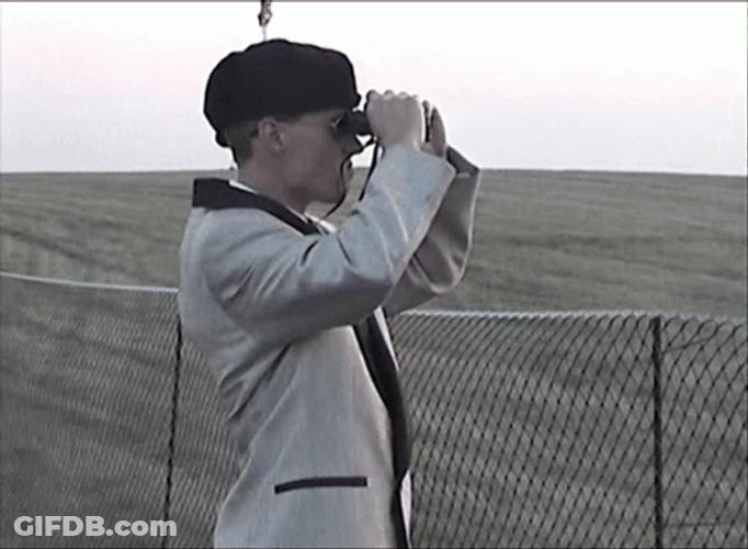 Watching The Area Using Binoculars GIF