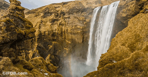 Waterfall In Canyon With Rainbow GIF