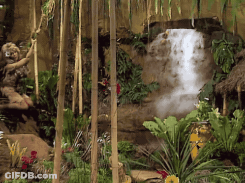 Waterfall Surrounded By Lush Green Jungle GIF