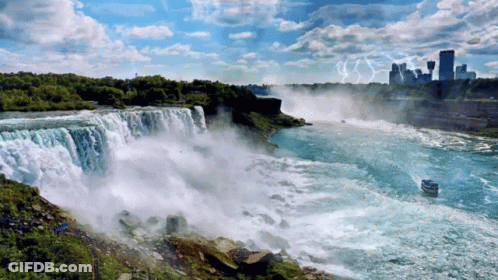 Waterfall With City And Boat GIF