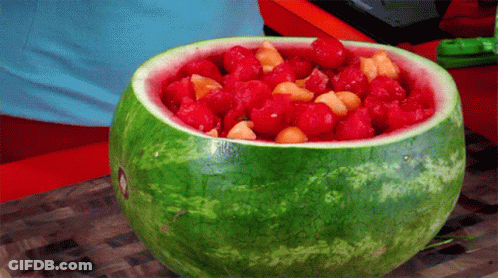 Watermelon Filled With Raspberries And Melons GIF