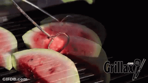 Watermelon Slices Are Being Cooked On A Grill With Grillax.com Written On The Bottom Right GIF