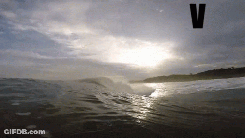 Wave Breaking On Beach With V GIF