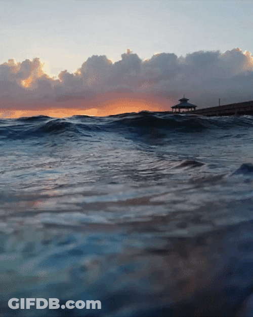 Waves And Sunrise Overlooking GIF