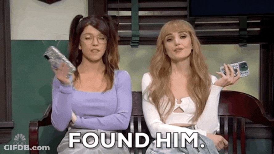 We Aint Found Two Women Holding Phone GIF