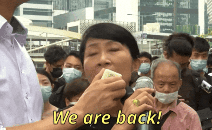 We Are Back Woman Speaking On Microphone GIF