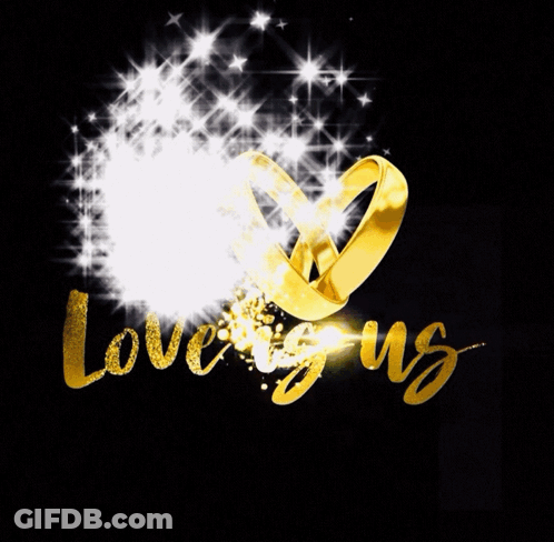 Wedding Rings Surrounded By Stars Saying Us GIF
