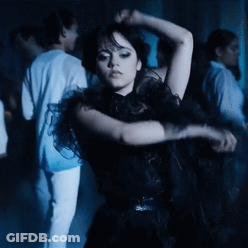 Wednesday Addams Arm Roll Dancing GIF