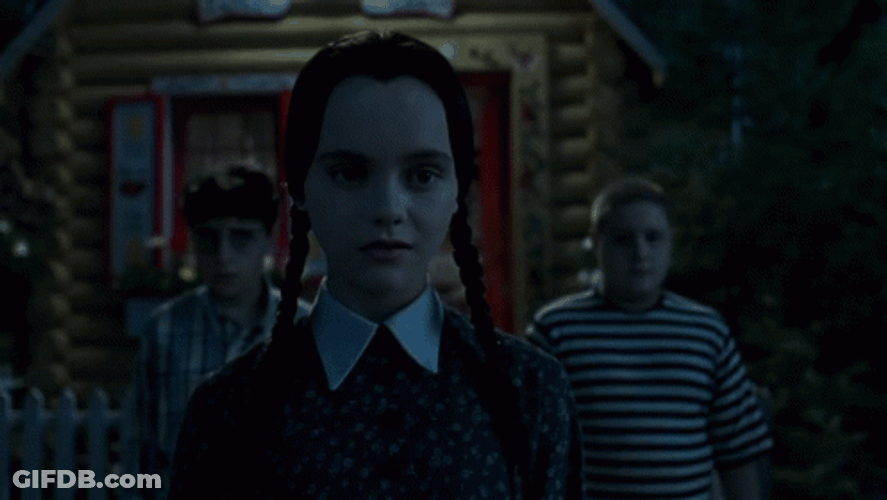 Wednesday Trying To Smile On Addams Family Thanksgiving GIF