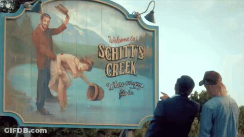 Welcome To Schitt's Creek Sign With Painting GIF