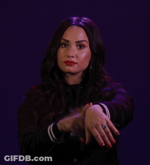Were Waiting Demi Lovato Pointing At Wrist Watch GIF