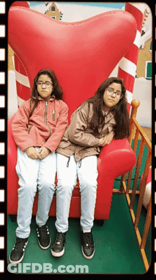 Were Waiting Twins Sitting On Big Chair GIF