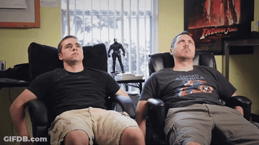 Were Waiting Two Men Sitting On Chairs GIF