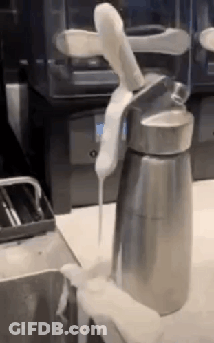 Whipped Cream Poured From Steel Container GIF