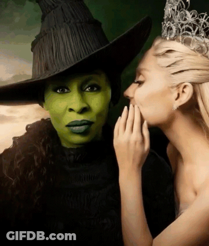 Whispering Into Ear Of Crowned Woman GIF