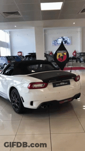 White Abarth In Car Showroom GIF