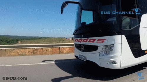 White And Black Bus With Odos On Front GIF