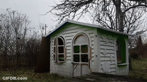 White And Green Playhouse In Forest GIF