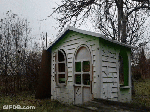 White And Green Playhouse With Sign GIF