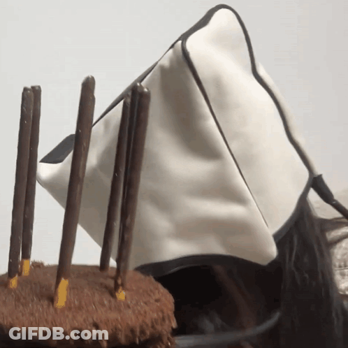 White Bag Next To Chocolate Cake GIF