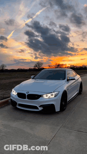 White BMW Parked At Sunset GIF