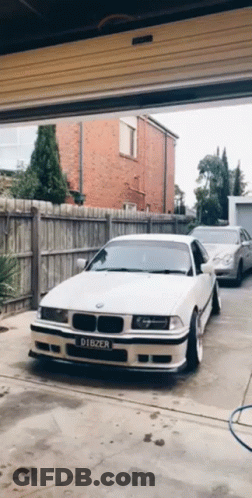 White BMW With License Plate Dibzer In Garage GIF