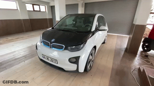 White BMW With License Plate RH GP 2617 GIF