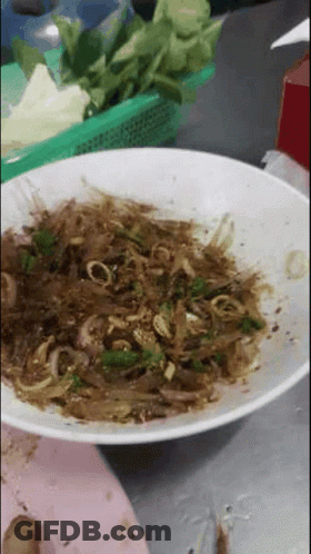 White Bowl Filled With Brown And Green Vegetable Dish GIF