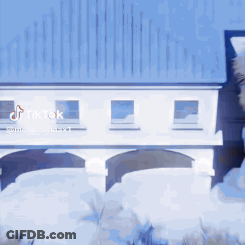 White Building With Blue Roof And TikTok Watermark GIF