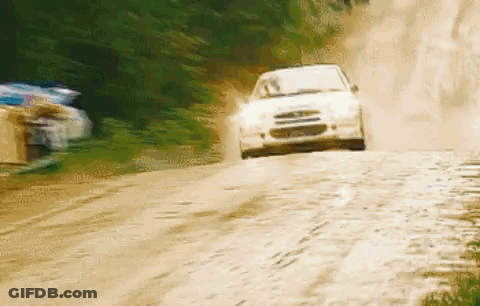 White Car Driving Down Dirt Road GIF