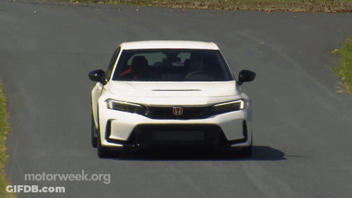 White Car Driving Down Road With Motorweek.org GIF