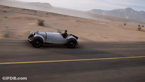 White Car Driving In Desert GIF