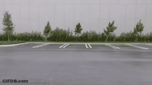 White Car Driving In Parking Lot GIF