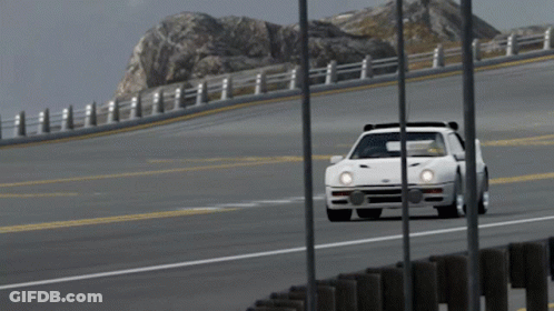 White Car Driving On Highway With Mountain GIF