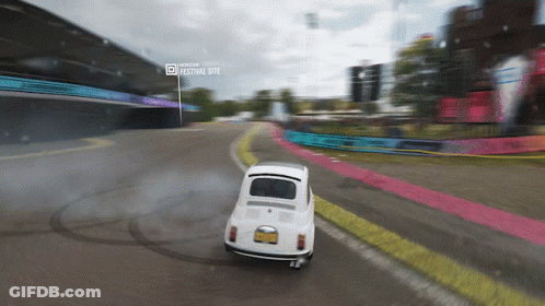 White Car Driving On Road Near Festival Site GIF