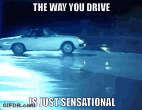White Car Driving On Wet Road Saying The Way You Drive Is Just Sensational GIF