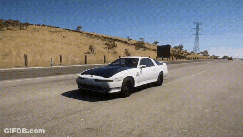White Car Driving With License Plate Saying SNR GIF
