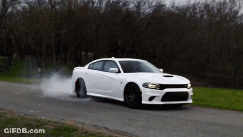 White Car Driving With Smoke From Tires GIF