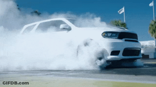 White Car Smoking Tire GIF