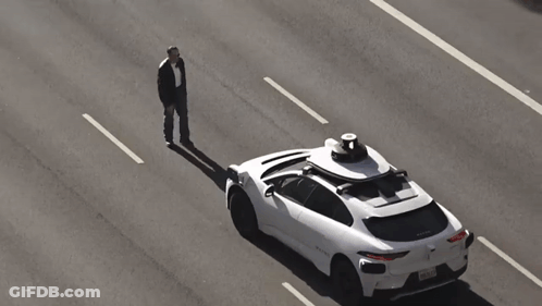 White Car With Black Object On Top GIF