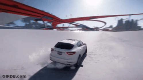White Car With California License Plate Driving Down Snowy Road GIF
