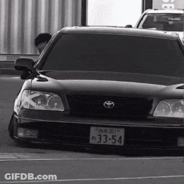 White Car With License Plate Saying JCW GIF