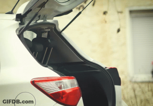 White Car With Open Trunk And Lit Tail Light GIF