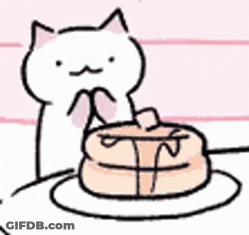 White Cat Sitting Next To Plate Of Food GIF