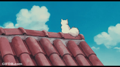 White Cat Sitting On Red Tiled Roof GIF