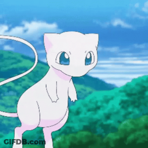 White Cat Standing In Green Field GIF