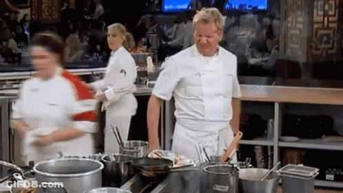 White Chef Surrounded By Pots And Pans GIF