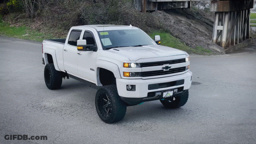 White Chevrolet Truck Parked On Side Of Road GIF