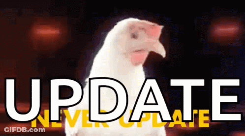 White Chicken In Front Of Update Sign GIF