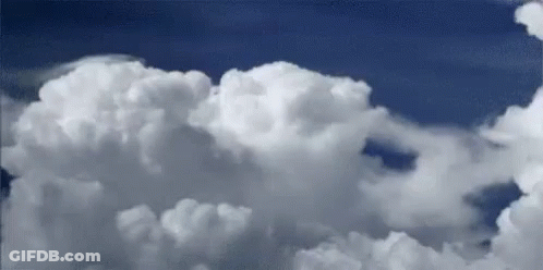 White Clouds Floating In Blue Sky GIF